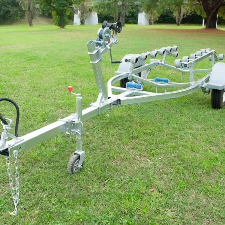 Front angle of a jetski trailer showing manual winch and jockey wheel